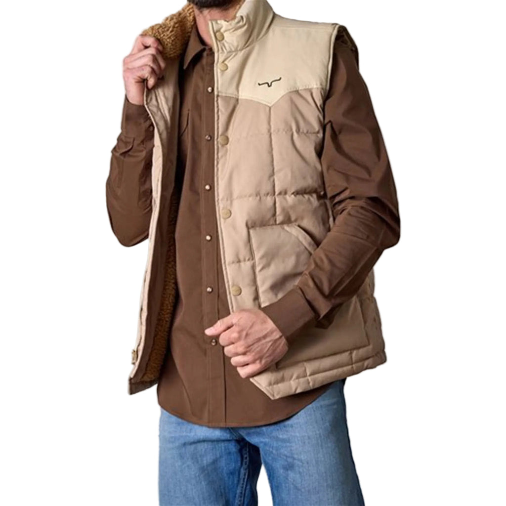 Man wearing a tan puffy vest