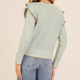 women's jade colored sweater with ruffle trim and brown stitching detail back view