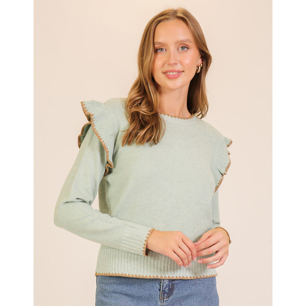 women's jade colored sweater with ruffle trim and brown stitching detail