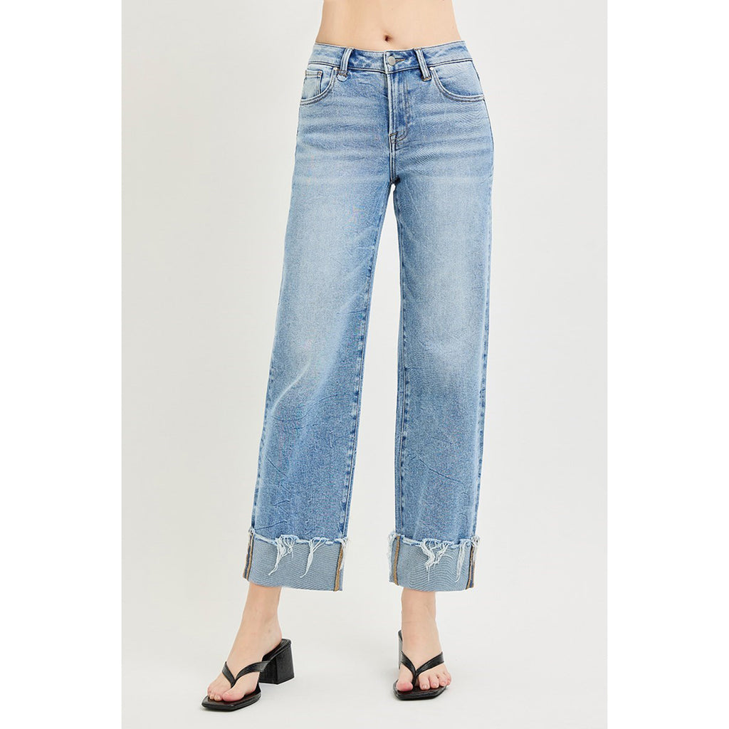 Female model wearing Light High Rise Crop Cuff Jeans, front view.