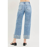 Female model wearing Light High Rise Crop Cuff Jeans, back view.