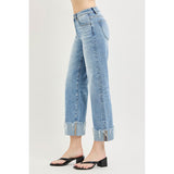 Female model wearing Light High Rise Crop Cuff Jeans, side view.