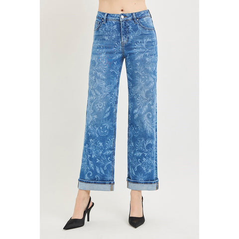 Model wearing Risen mid rise floral print straight ankle jeans, front view showing the mid‑rise fit, straight leg, and subtle floral printed detailing.