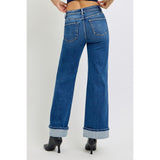 Back view of model wearing High Rise Wide Leg Cuff Jeans with relaxed wide‑leg fit and cuffed hem.