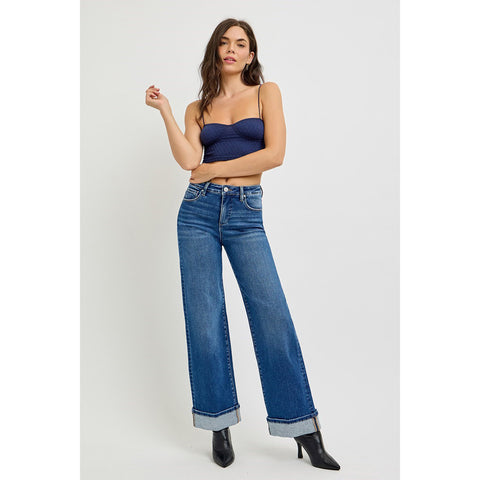 Model styling High Rise Wide Leg Cuff Jeans with a casual top for a modern, relaxed look.