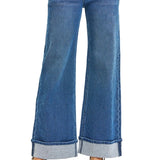 front view of jeans, wide leg medium blue jean color and rolled cuff.