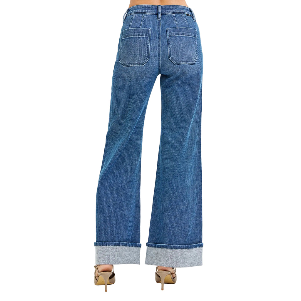 Back view of high waisted textured jean with a cuff on the bottom hem