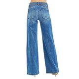 Back view of a model wearing high rise wide leg waist detail jeans, showing the lifted fit, clean back pockets, and wide leg shape.