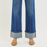 View of the bottoms of the jeans, cuff has a sewn end.