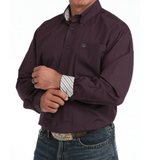 Inside the cuff of the purple button down is stripes 