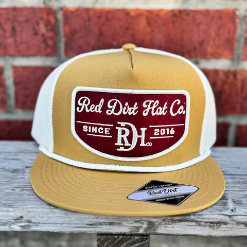 Mustard cap with white rope and maroon and white red dirt logo.