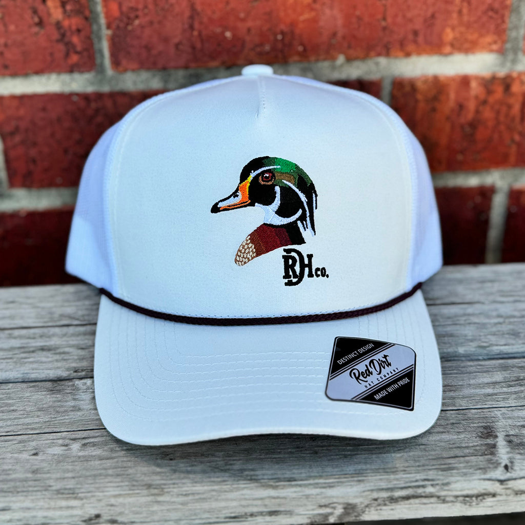 White cap with black rope and a mallard duck red dirt logo.