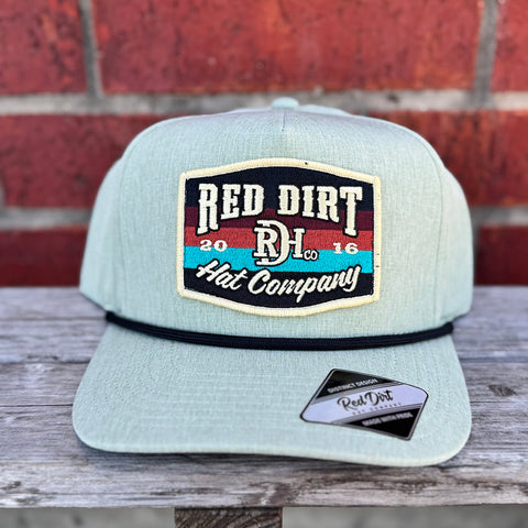 Mine cap with black rope and tan multi colored red dirt logo.