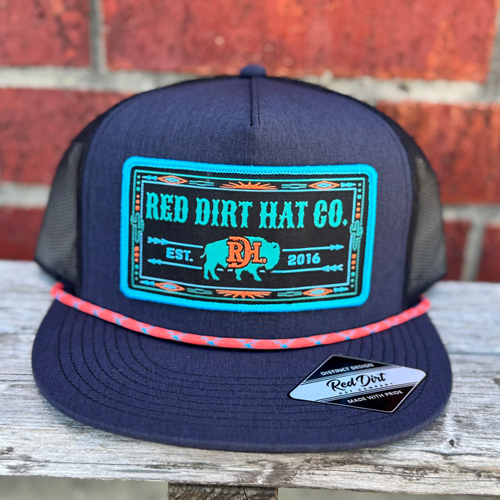 navy and black cap with turquoise and orange red dirt buffalo patch.