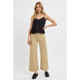 Styled view of cropped high rise latte colored jeans