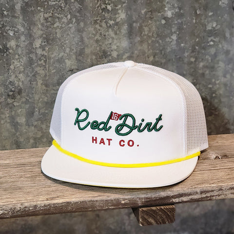 white cap, yellow rope across Green writing 