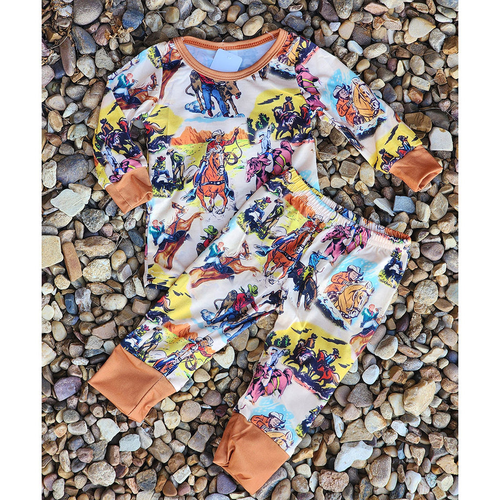 Infant boys 2-piece rodeo pajamas with cowboy-themed print, long sleeve top and elastic waist pants in soft cotton blend
