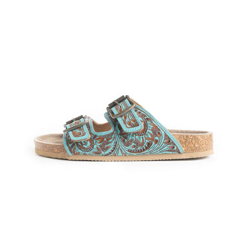 Side view of tooled turquoise sandals. 