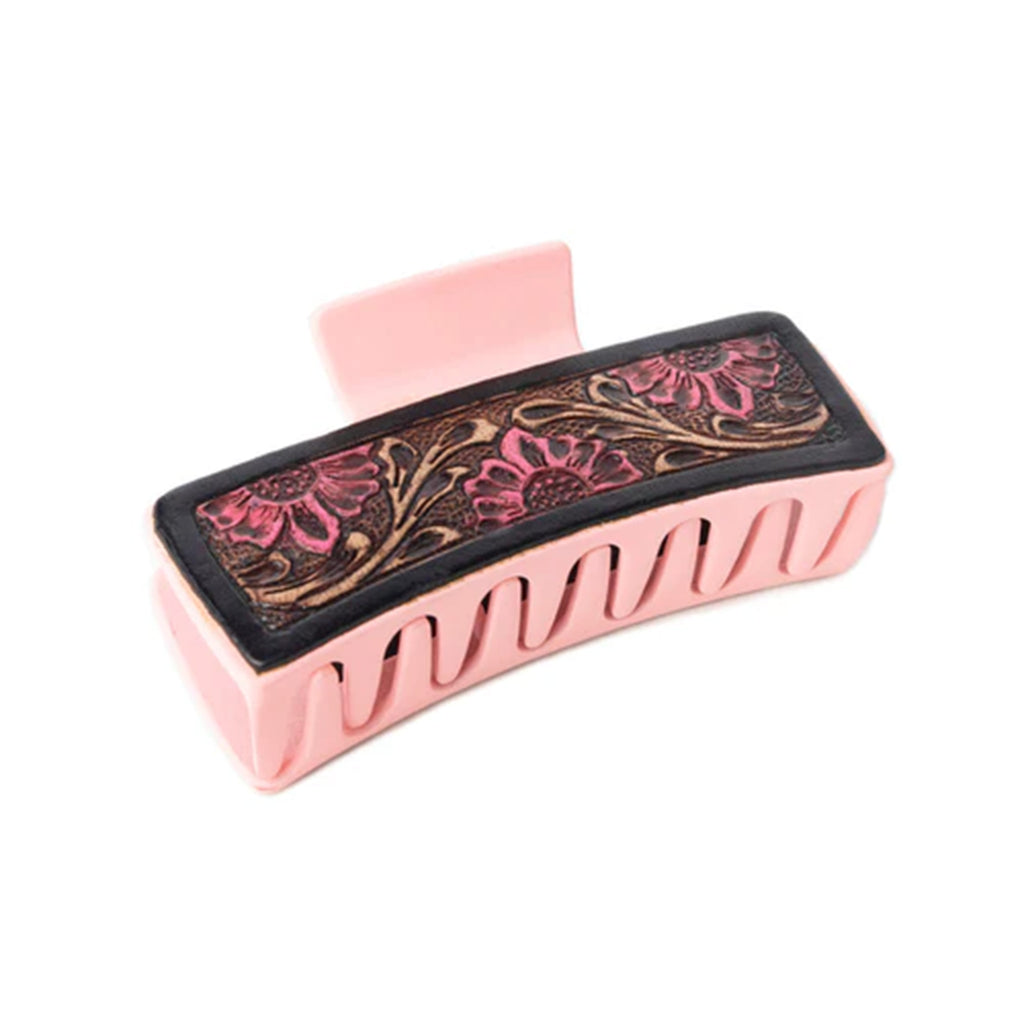 Light pink hair clip with floral leather tooling.