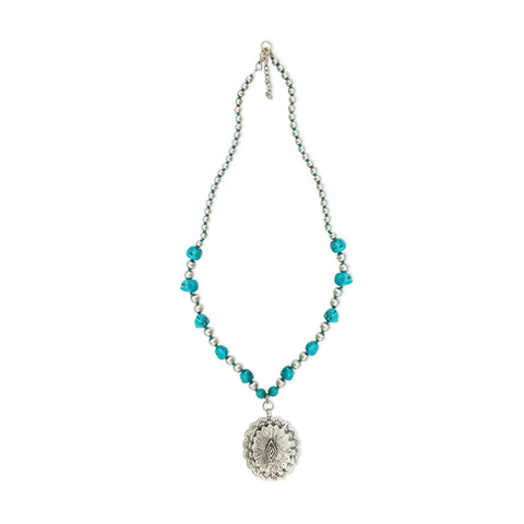 Silver and turquoise beaded necklace with Concho pendant at the bottom. 