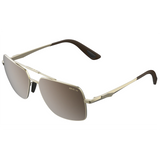 Bex Wing Sunglasses. They have a matte gold frame with brown tinted lenses with a silver flash.