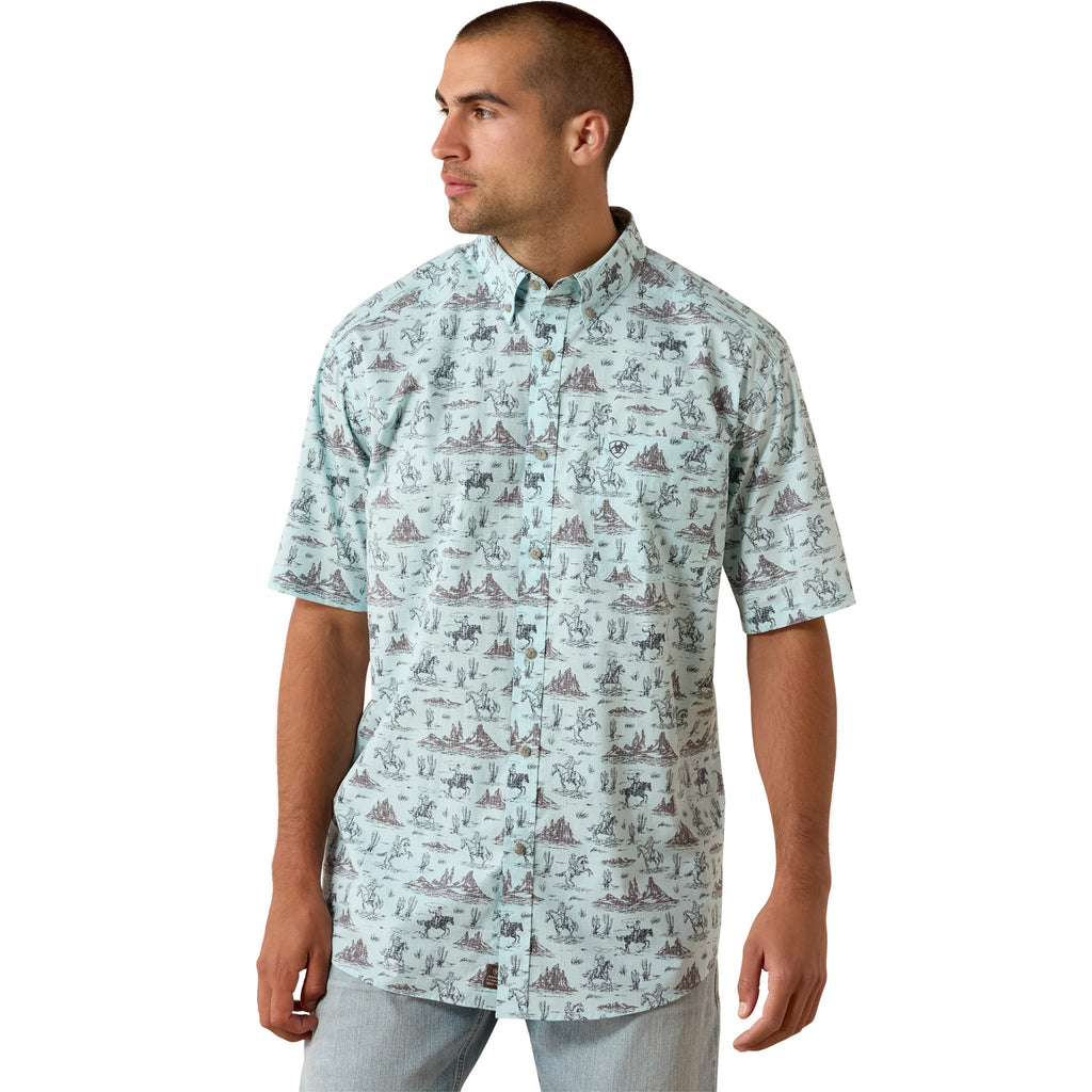 Model wearing the Ariat Men’s Glow Blue Western Print Short Sleeve Shirt in a front view, showing the glow‑blue Western print, short sleeves, and classic button‑down styling.