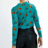 Back view of teal mesh undershirt with brown vintage western inspired patterning.