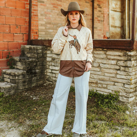 Full view of model wearing shirt. This piece just includes the sweater and not the brown under shirt.