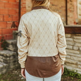 Back of the shirt, plain except for the faded diamond pattern.