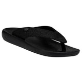 A black HEYDUDE sandal that's open-toed. It's pictured from an angle to where you can both the top and side of the sandal. The background is white.