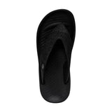 A black sandal that's open-toed pictured from the top. There is a discrete lined pattern on the insole.