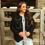 Soft black jacket with white pipping and turquoise concho buttons 