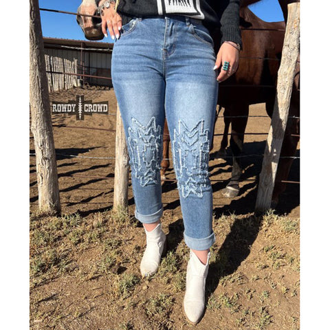 Rolled Up Angle Jeans with a Frayed Aztec Design on Front Legs
