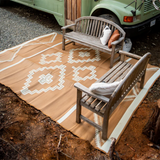 Tan Aztec print outdoor rug that is reversable 9 X 12