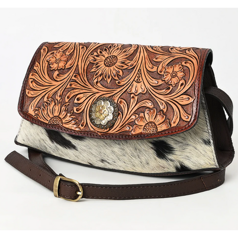 Cowhide purse with tooled leather flap and flower concho 