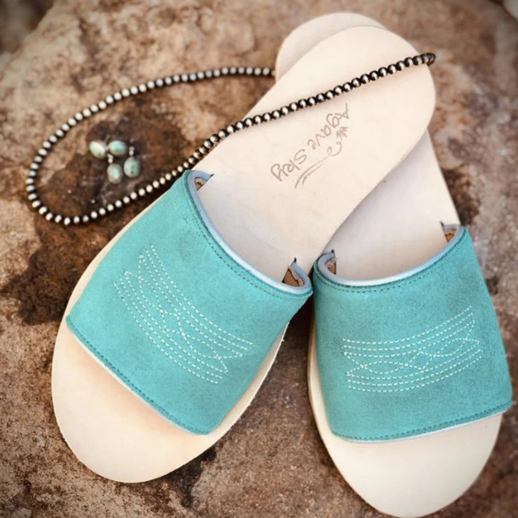 Turquoise rough out sandal with silver boot stitch stitching.