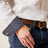 Close up view of contrast sleeve cuff with blue geometric pattern. 