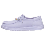 Side view of Hey Dude Purple Wendy Funk Shoelry with lightweight EVA outsole and micro suede heel detail