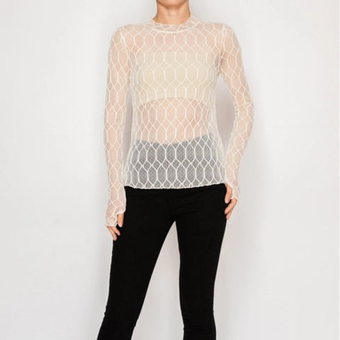 Woman wearing beige mesh long sleeve top layered