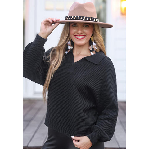 Women’s black Zander collared sweater with soft knit fabric and a relaxed fit.

