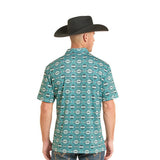 A man wearing a turquoise short-sleeve button-up shirt with a white geometric pattern, shown from the back.