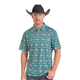 A man wearing a teal short-sleeve western shirt with a white geometric pattern, paired with a black cowboy hat against a plain white background.