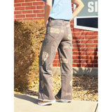 Side view of the brown cowboy graphic jeans 