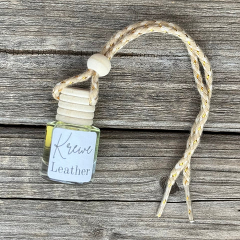 Small Bottle with Krewe Leather Smell with rope to hang 