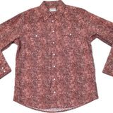 Flat lay of Brown pearl snap shirt with a floral leather print and two snap chest pockets. 
