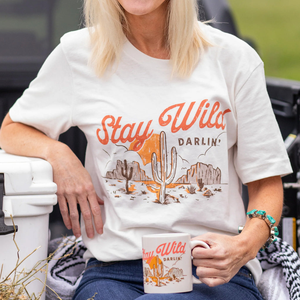 women's white short sleeved t shirt with stay wild darlin graphic on front