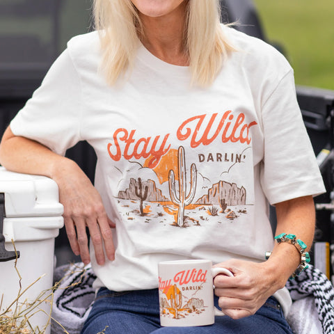 women's white short sleeved t shirt with stay wild darlin graphic on front