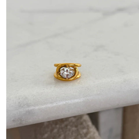 Gold with a stone in the middle 