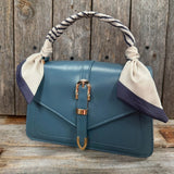 Cream and Navy Striped Western Twilly on a purse