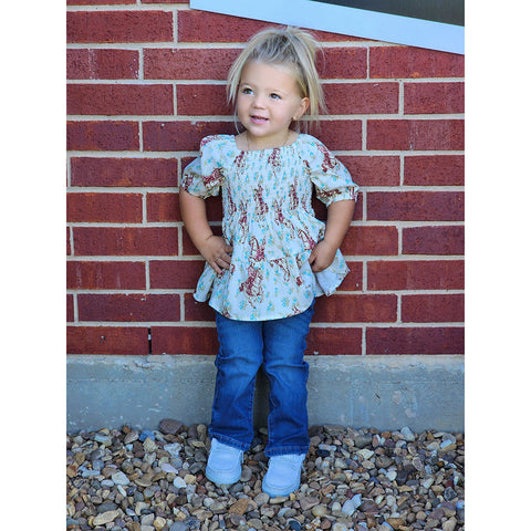 Ivory color with flower and cowgirls all over, tunic style top 